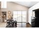 Kitchen with breakfast nook and sliding glass doors to patio at 9053 W 103Rd Ave, Broomfield, CO 80021