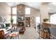 Living room with a stone fireplace and built-in shelving at 9053 W 103Rd Ave, Broomfield, CO 80021