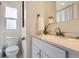 Bright bathroom with modern vanity, white subway tile, and marble countertops at 1120 Quince St, Denver, CO 80220