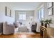 Cozy living room with neutral furnishings, hardwood floors and plenty of natural light at 1120 Quince St, Denver, CO 80220