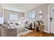Inviting living room with hardwood floors, neutral decor, and plenty of natural light at 1120 Quince St, Denver, CO 80220