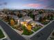 Breathtaking aerial view of a luxury home in a well-manicured neighborhood at twilight at 9586 Silent Hills Ln, Lone Tree, CO 80124