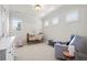Cozy Bedroom with a crib, gray glider chair, and natural light from multiple windows at 9586 Silent Hills Ln, Lone Tree, CO 80124