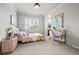 Bedroom with a desk and chair near the window at 9586 Silent Hills Ln, Lone Tree, CO 80124