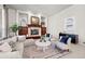 Inviting living room with a fireplace, built-ins, and comfortable seating at 9586 Silent Hills Ln, Lone Tree, CO 80124