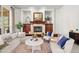 Inviting living room with a fireplace, built-ins, and comfortable seating at 9586 Silent Hills Ln, Lone Tree, CO 80124