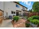 Backyard featuring an enclosed patio with planters and garden with red brick at 3571 S Kittredge St # C, Aurora, CO 80013