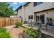 Backyard featuring an enclosed patio with planters and garden at 3571 S Kittredge St # C, Aurora, CO 80013