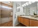 Bathroom featuring vanity with granite countertop, with shower and tub combination at 3571 S Kittredge St # C, Aurora, CO 80013