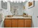 Bathroom featuring vanity with granite countertop, with shower and tub combination at 3571 S Kittredge St # C, Aurora, CO 80013