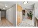 Hallway with many storage closets and a dining area with natural light and bamboo flooring at 3571 S Kittredge St # C, Aurora, CO 80013