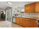 Bright kitchen with wood cabinets, granite countertops, stainless steel appliances and tile floors at 3571 S Kittredge St # C, Aurora, CO 80013