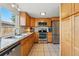 The kitchen features wood cabinets, stainless steel appliances, and granite countertops at 3571 S Kittredge St # C, Aurora, CO 80013