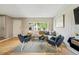Bright living room featuring hardwood floors, neutral walls, and modern furnishings at 3571 S Kittredge St # C, Aurora, CO 80013