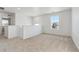 This spacious loft features two windows for natural light and plush neutral carpeting at 1671 Pinnacle Ave, Lochbuie, CO 80603