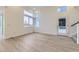 Bright and spacious living area with vinyl plank flooring and access to a patio at 1234 S Algonquian St, Aurora, CO 80018