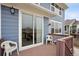Cozy outdoor deck with sliding glass door access, perfect for enjoying the view and relaxing outdoors at 2015 E 167Th Ln, Thornton, CO 80602