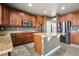 Well-equipped kitchen with granite countertops and stainless steel appliances at 2015 E 167Th Ln, Thornton, CO 80602