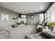 Comfortable living room with a fireplace and plush reclining sofas at 2015 E 167Th Ln, Thornton, CO 80602