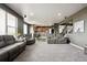 Spacious living room with an open floor plan and multiple seating areas at 2015 E 167Th Ln, Thornton, CO 80602
