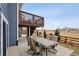 Outdoor patio featuring an outdoor dining set with backyard views, ideal for enjoying outdoor meals at 2015 E 167Th Ln, Thornton, CO 80602