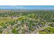 A broad aerial shot reveals an attractive neighborhood with trees, roads and local sports parks at 10421 Kennemere Ln, Parker, CO 80134