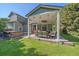 Backyard featuring a covered patio with outdoor seating and a spa at 10421 Kennemere Ln, Parker, CO 80134