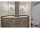 Bright bathroom with granite counters, dual sinks, and shower with a curtain at 10421 Kennemere Ln, Parker, CO 80134