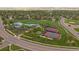 Aerial view of community amenities, featuring a pool, sports courts, and green spaces at 10421 Kennemere Ln, Parker, CO 80134