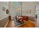 Elegant dining room with large windows and stylish decor at 10421 Kennemere Ln, Parker, CO 80134