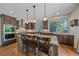 Well-equipped kitchen with dark wood cabinetry and modern appliances at 10421 Kennemere Ln, Parker, CO 80134