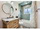 Stylishly updated bathroom with marble vanity and shower and modern fixtures, offering a spa-like experience at 6661 Lamar St, Arvada, CO 80003