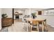 Open-concept dining area adjacent to kitchen, perfect for entertaining guests and Gathering meals at 6661 Lamar St, Arvada, CO 80003