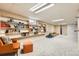 Spacious living room with built-in shelves and an orange chair at 6661 Lamar St, Arvada, CO 80003