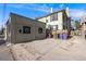 Backyard view showing the parking area and fence bordering the neighboring property at 1057 N Emerson St # B, Denver, CO 80218