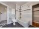 Bathroom with tiled shower/tub, updated vanity, tile floors, and bright window at 1057 N Emerson St # B, Denver, CO 80218
