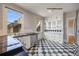 Bright kitchen features built in cabinets, stainless appliances, and checkered floors at 1057 N Emerson St # B, Denver, CO 80218
