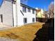 Backyard with new sod, gravel and a home with white siding and black trim at 11304 Elm Dr, Thornton, CO 80233