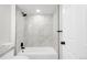 Modern bathroom featuring a tiled shower, sleek fixtures, and clean design at 11304 Elm Dr, Thornton, CO 80233