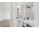 Updated bathroom featuring a white vanity, granite countertop, and tiled shower and bathtub at 11304 Elm Dr, Thornton, CO 80233