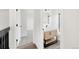 Bright bathroom featuring vanity, wood accents, and doorway into another room at 11304 Elm Dr, Thornton, CO 80233