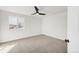 Bedroom with neutral carpeting, large window and ceiling fan at 11304 Elm Dr, Thornton, CO 80233