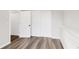 Bright bedroom featuring new laminate flooring and a large closet at 11304 Elm Dr, Thornton, CO 80233