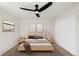Cozy bedroom featuring a comfortable bed, neutral decor, and ample closet space at 11304 Elm Dr, Thornton, CO 80233