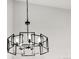 Modern black chandelier fixture with geometric design hanging in a room at 11304 Elm Dr, Thornton, CO 80233