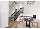 Inviting entryway with modern railing, stylish decor, and hardwood floors at 11304 Elm Dr, Thornton, CO 80233