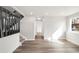 Open floor plan with hardwood floors and staircase at 11304 Elm Dr, Thornton, CO 80233