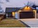 Charming home featuring a modern garage door, updated finishes, and inviting curb appeal at 11304 Elm Dr, Thornton, CO 80233