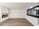 Spacious living room with electric fireplace, recessed lights, and access to outdoor space at 11304 Elm Dr, Thornton, CO 80233