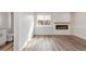 Bright living room with a fireplace, hardwood floors, and ample natural light at 11304 Elm Dr, Thornton, CO 80233